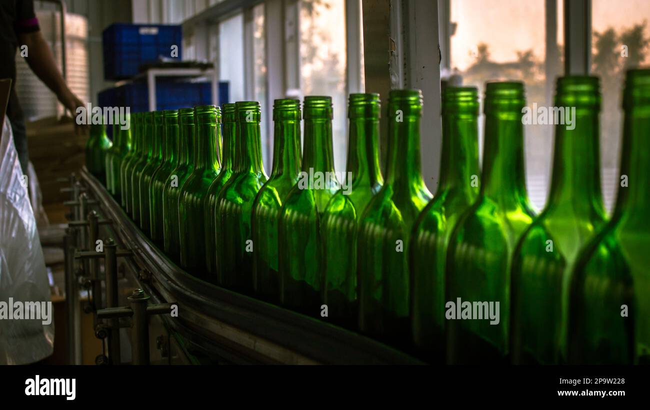 wine bottle in row factory bottling plant Stock Photo