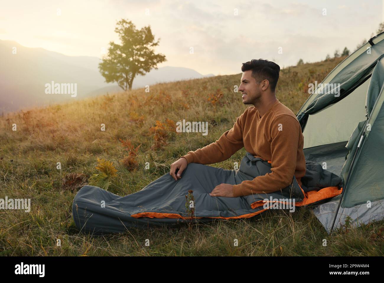 Person in green sleeping bag hi-res stock photography and images - Alamy