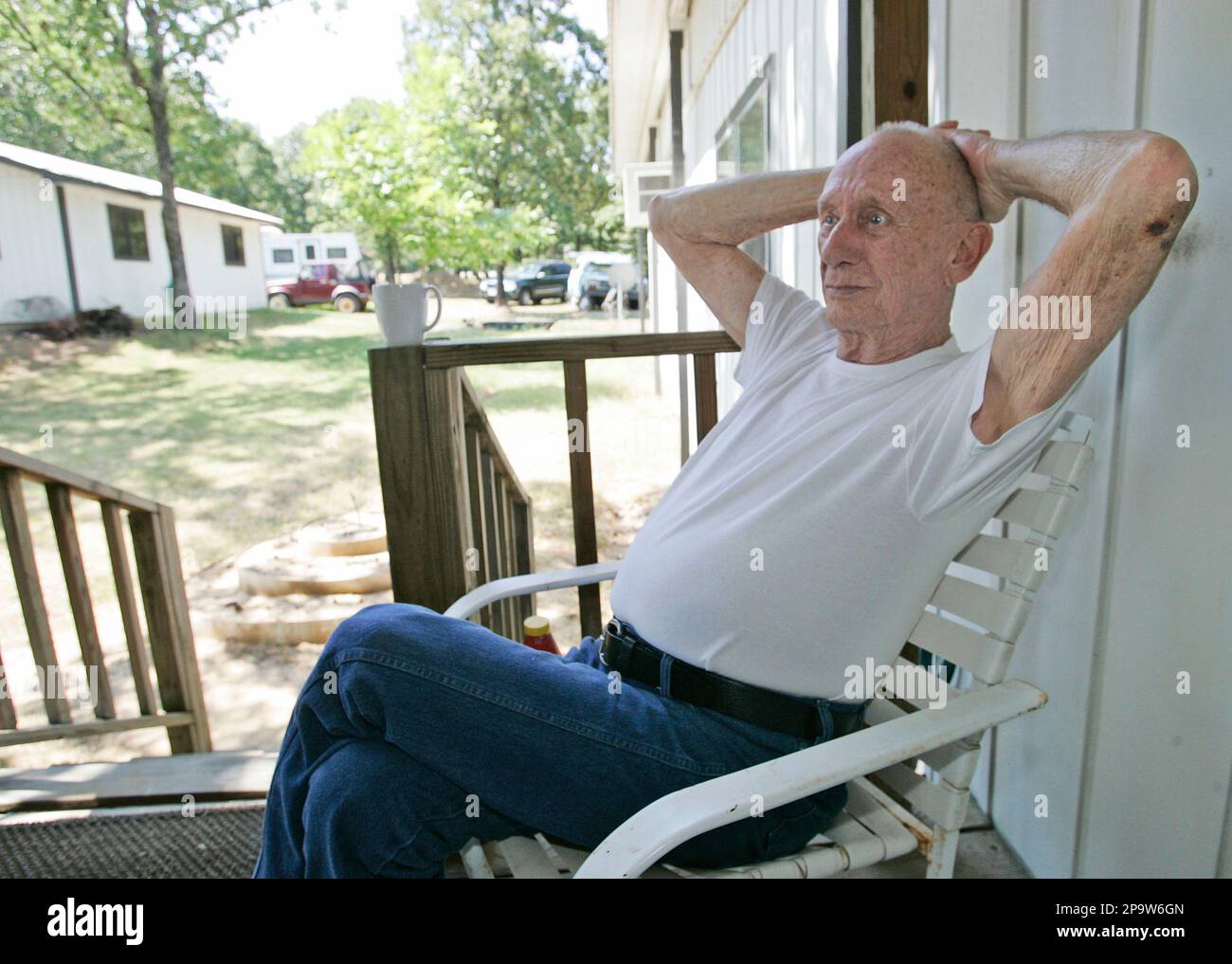 John Poling, a Korean war veteran, sits on his porch in the United
