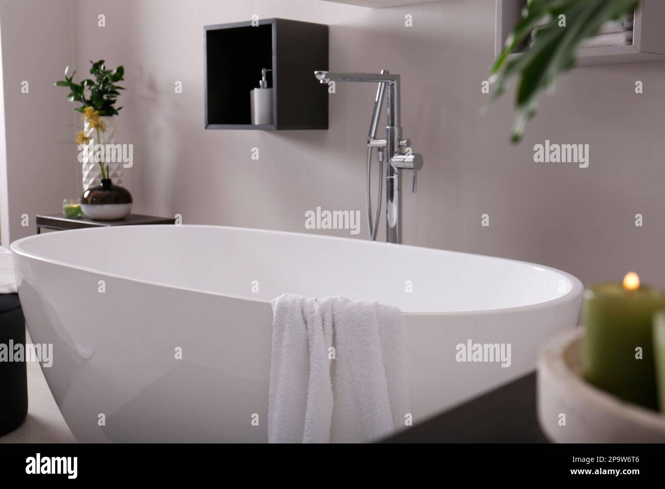 Stylish bathroom interior with modern white tub Stock Photo - Alamy
