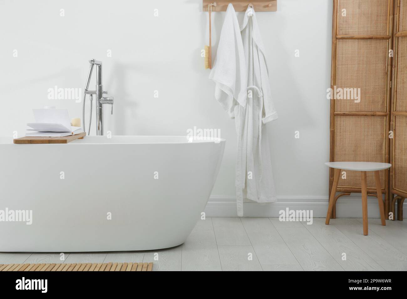 Stylish bathroom interior with modern white tub Stock Photo - Alamy