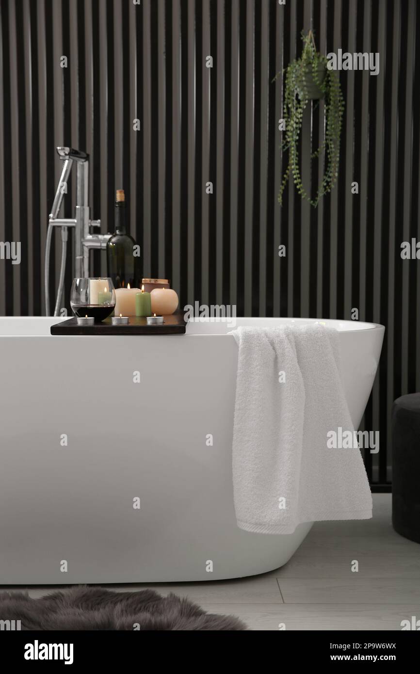 Stylish bathroom interior with modern white tub Stock Photo - Alamy