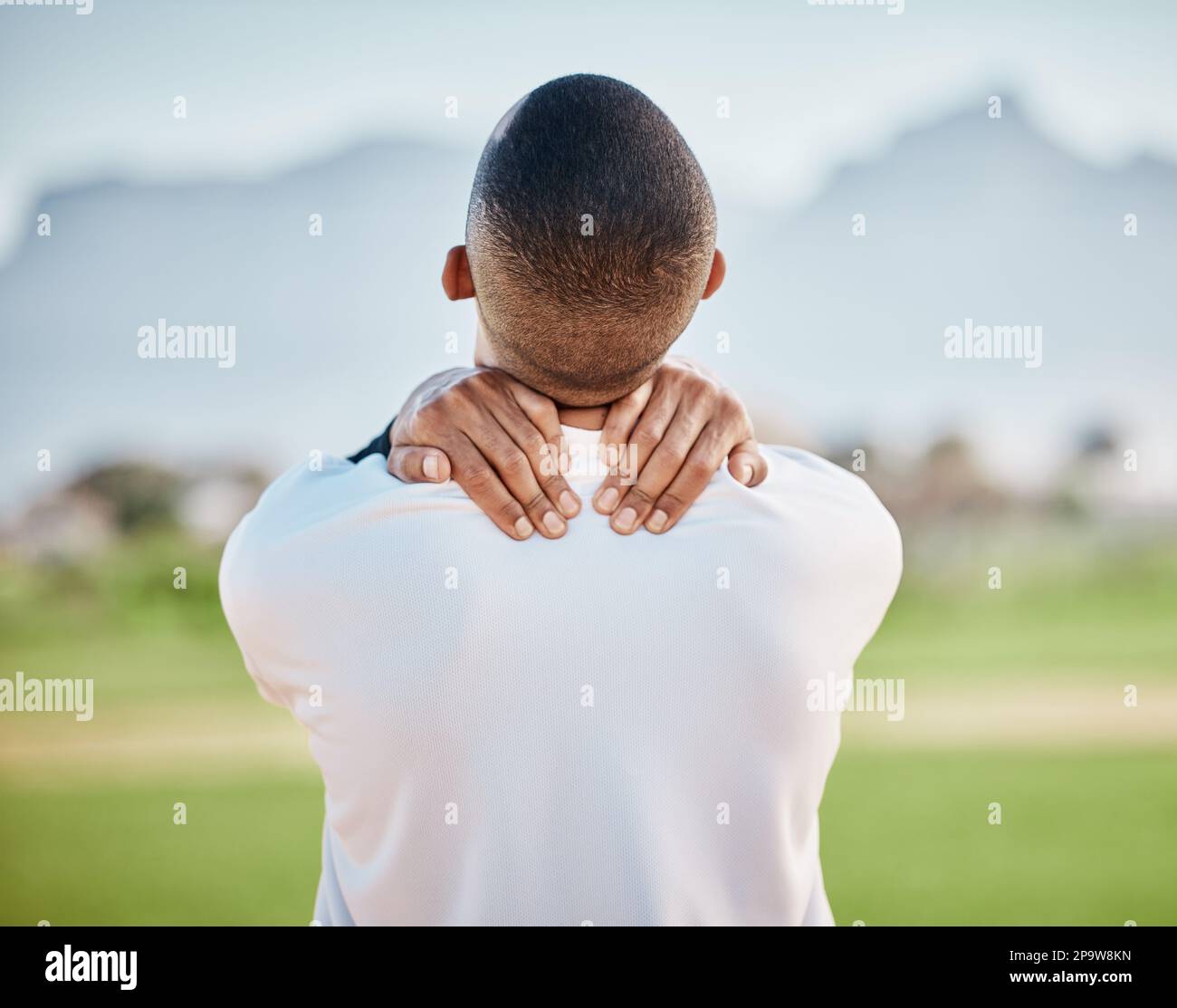 Neck pain, injury and athlete hurt on sports field at training, fitness