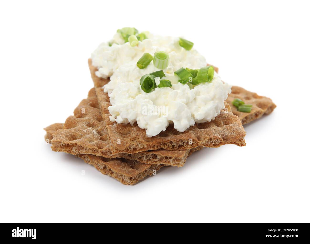 Crispy crackers with cottage cheese and green onion on white background Stock Photo Alamy