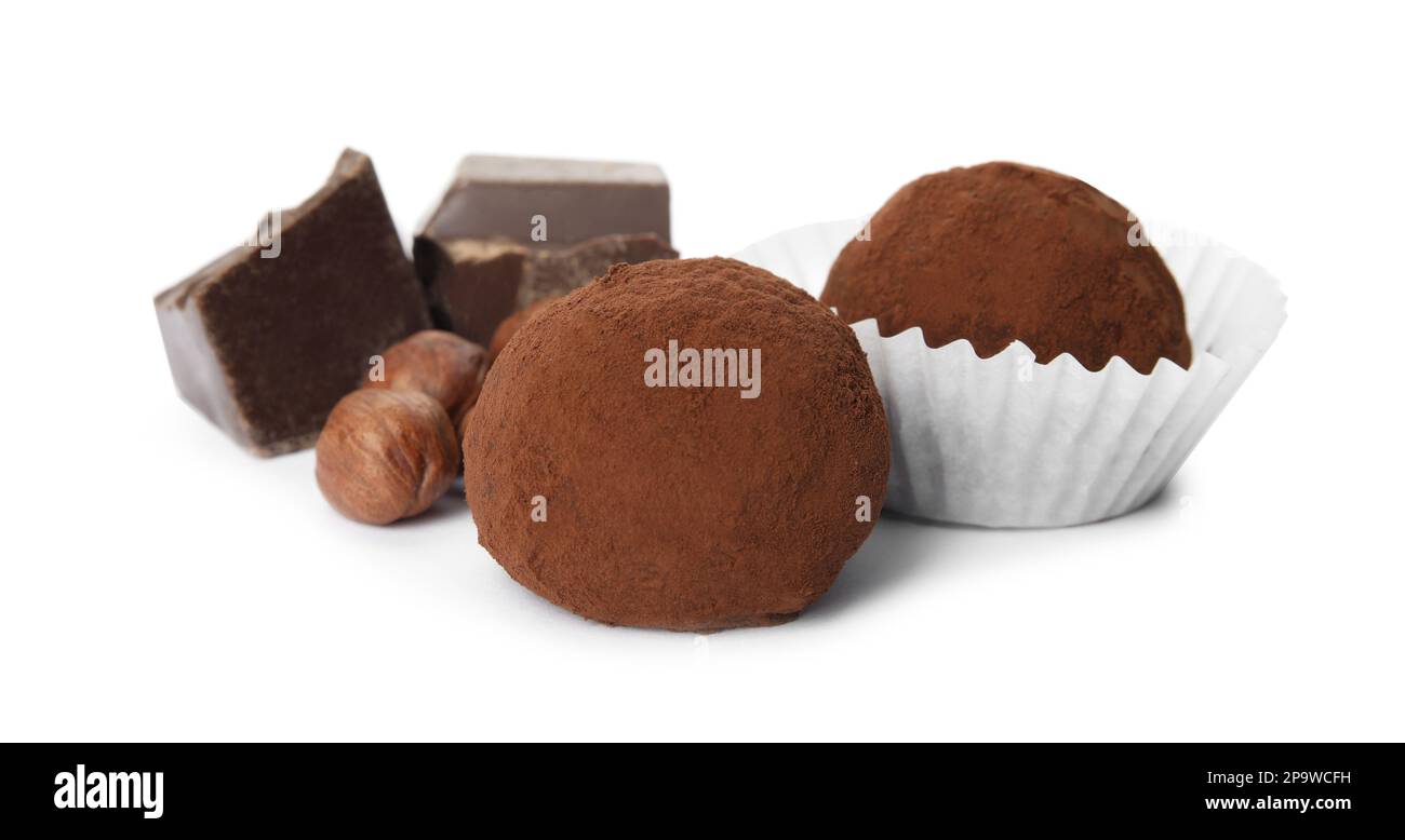 Delicious chocolate truffles with ingredients on white background Stock ...