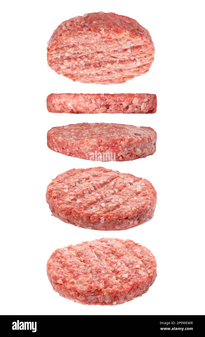Fresh raw burger patties and falling on white background Stock Photo