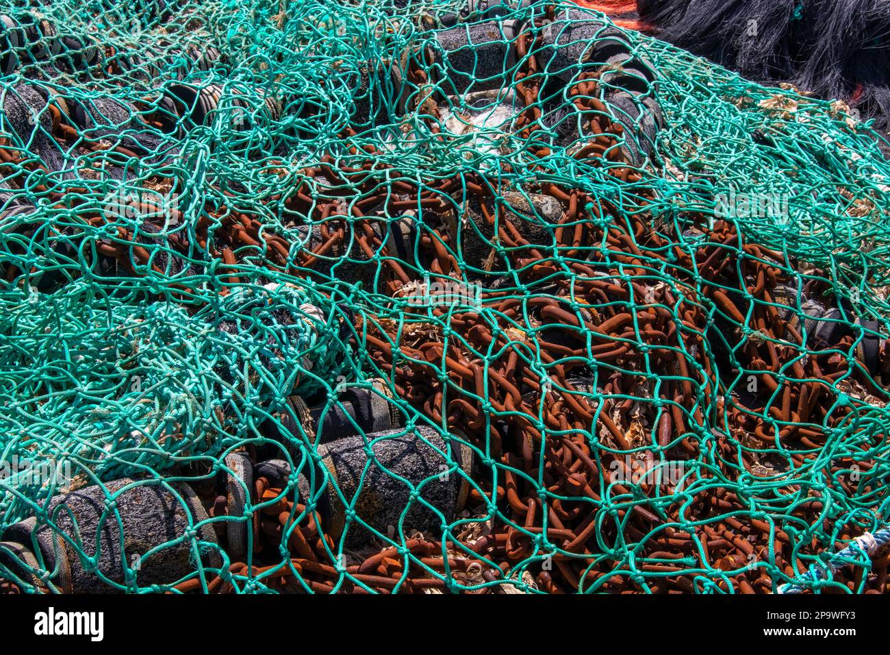 Drying of industrial fishing nets in piles Stock Photo Alamy