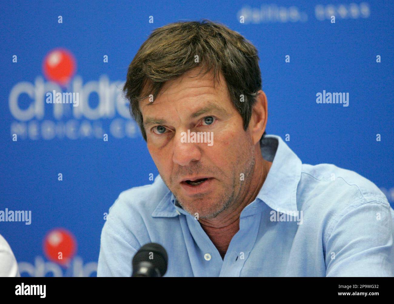 Actor Dennis Quaid talks at a news conference after touring Children's