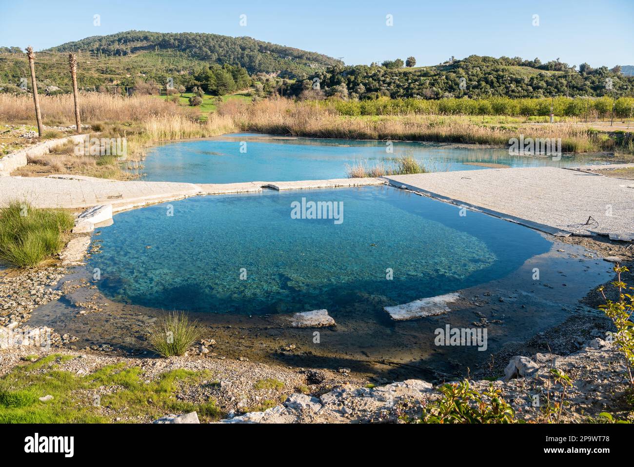 Pool of Kapukargin natural sulfur thermal bath near Dalaman town in Mugla province of Turkey. Stock Photo