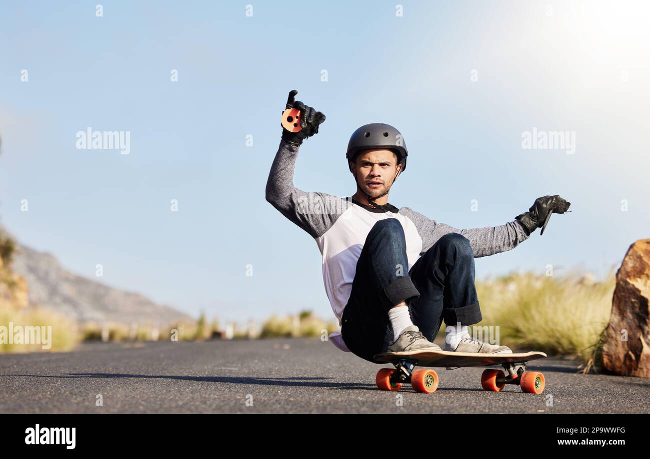 Skateboard, slide and man in road for sports competition, fitness