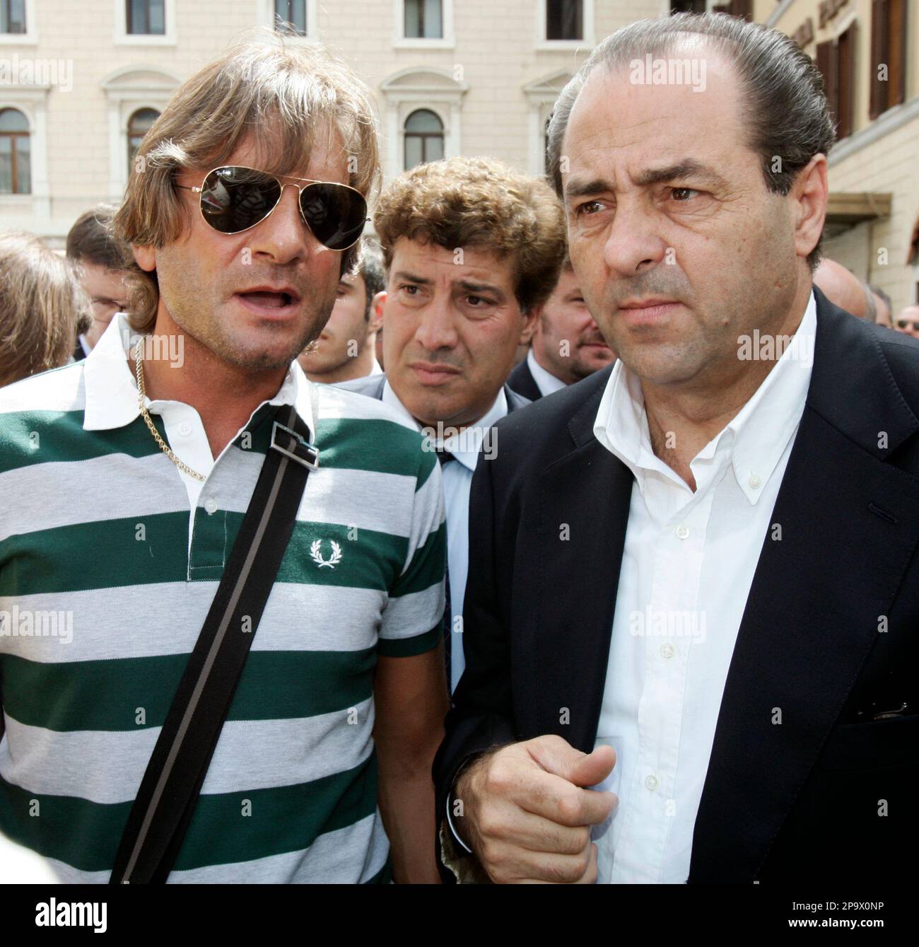 Antonio di Pietro talks with Marco Valerio Cervellini, secretary of the UGL  Italian Police Union, during a demonstration in front of the Chamber of  Deputies in Rome Thursday, July 17, 2008. (AP