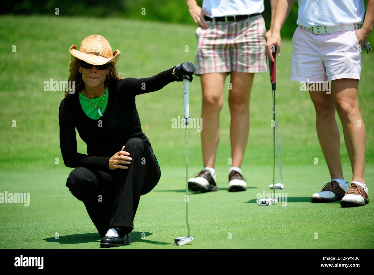 Alexandra Steele, weather channel anchor, checks her line of sight to the  hole on the green during the 2008 Women's Golf Classic to benefit Girls  Inc. at the Golf Club at Bradshaw