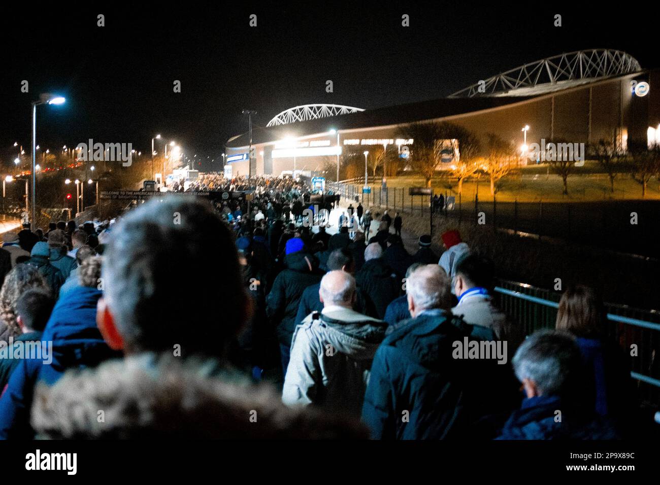 People head to the AMEX Stadium, Brighton & Hove's ground, to watch Brighton vs Tottenham, 16th March 2022 Stock Photo