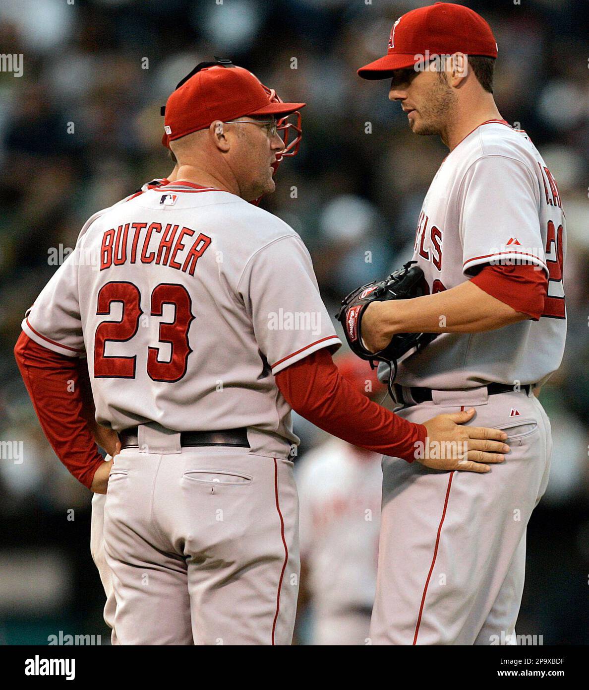Los Angeles Angels pitching coach Mike Butcher (23) tries to settle down  Jon Garland during the third inning of a baseball game against the Oakland  Athletics on Friday, July 11, 2008, in