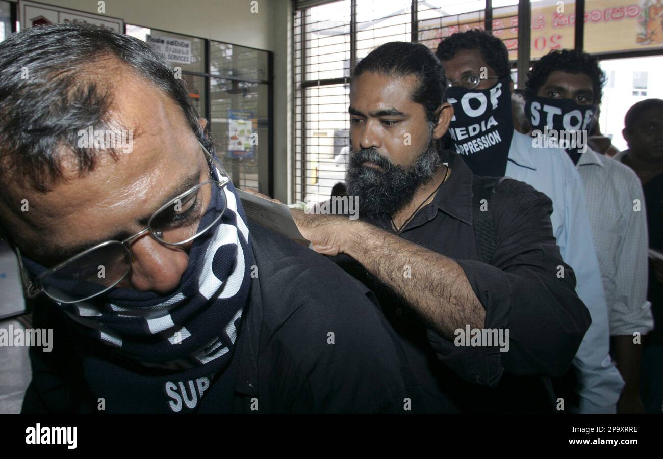 Sri Lankan activists for media freedom wear masks to protest against the  suppression of media as they write a telegram to President Mahinda  Rajapaksa, urging him to safeguard media freedom, at a