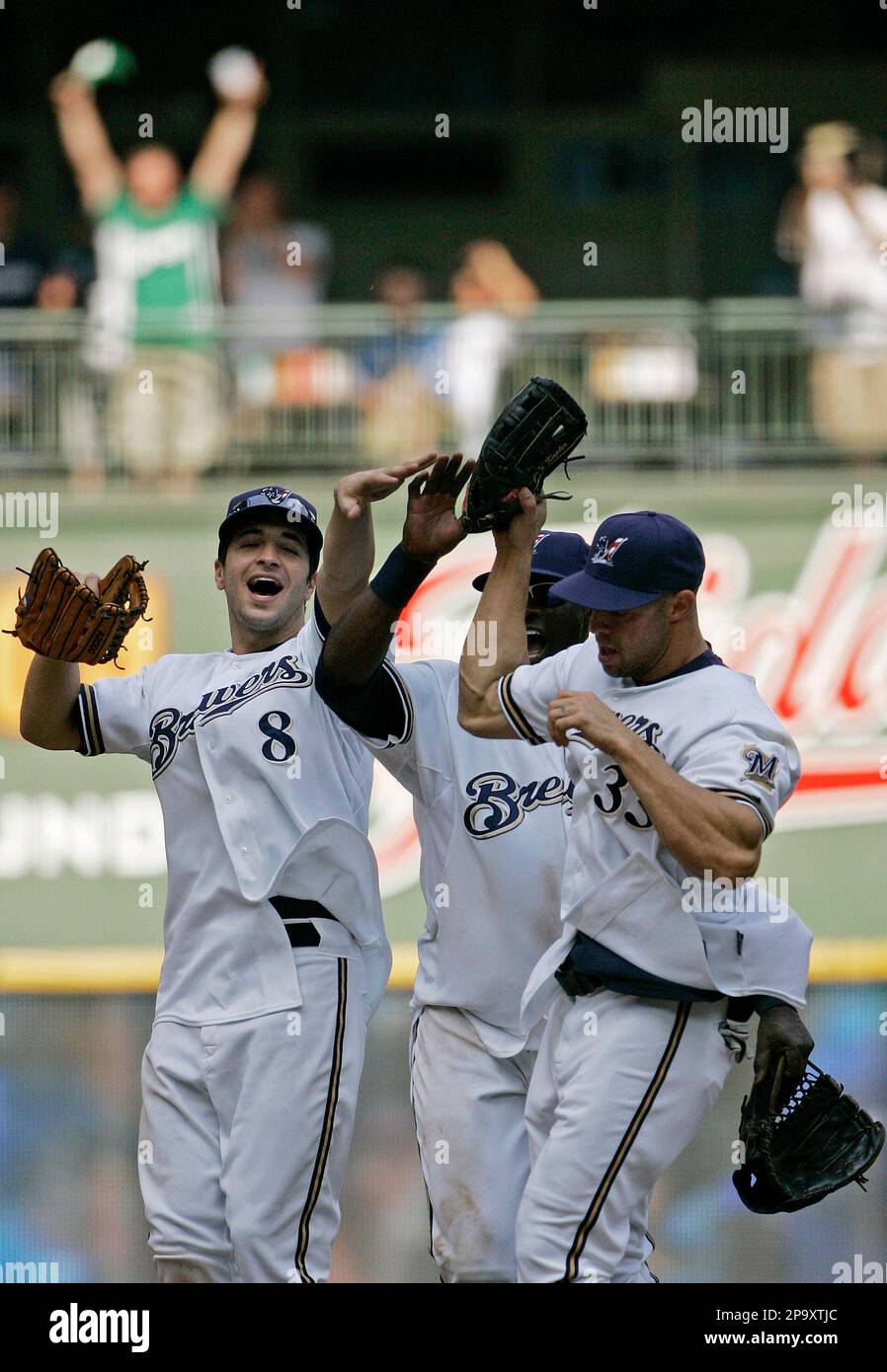 Milwaukee Brewers' Ryan Braun (8), Gabe Kapler (33) and Mike Cameron,  center, celebrate after the ninth inning of a baseball game against the  Pittsburgh Pirates on Sunday, July 6, 2008, in Milwaukee.
