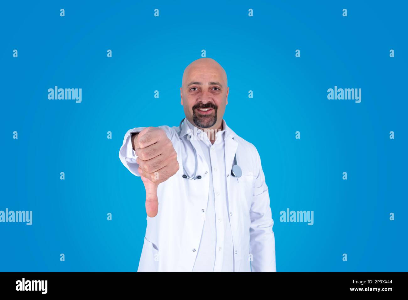 Doctor showing thumb down. Sadly smiling