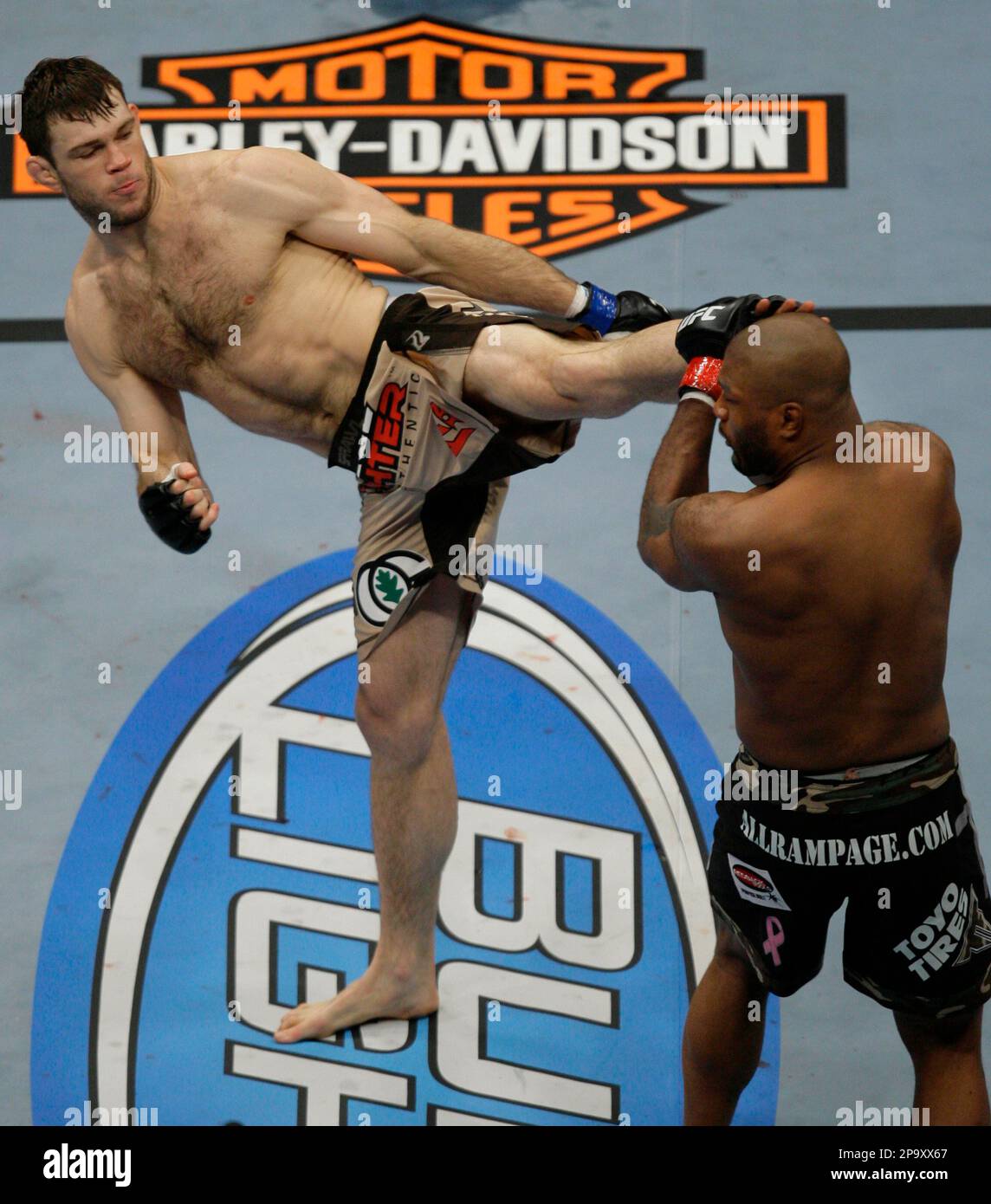 Forrest Griffin, left, lands a kick to Quinton Jackson during their UFC