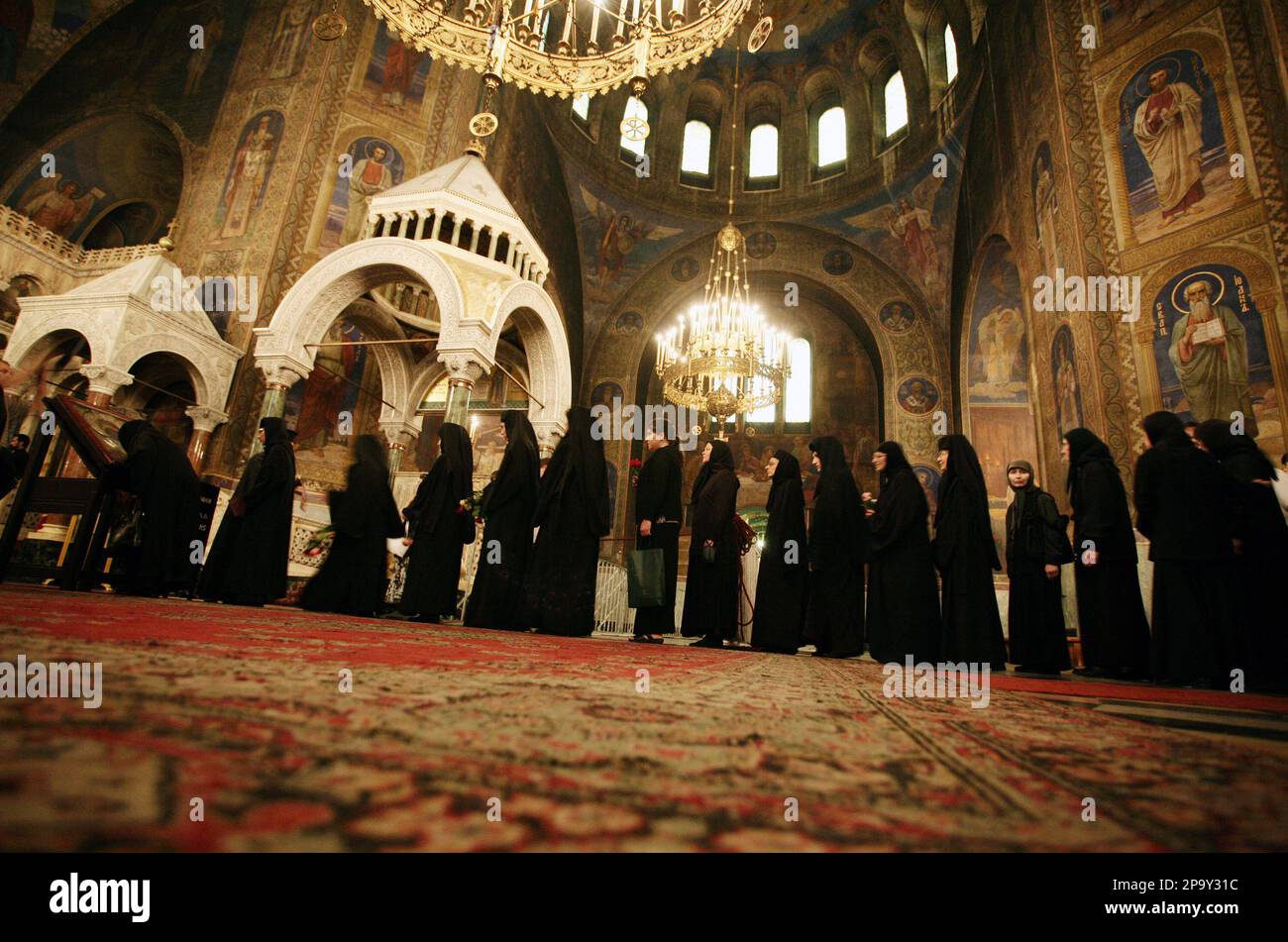 Bulgarian orthodox nuns wait to kiss the miraculous icon of the Virgin ...