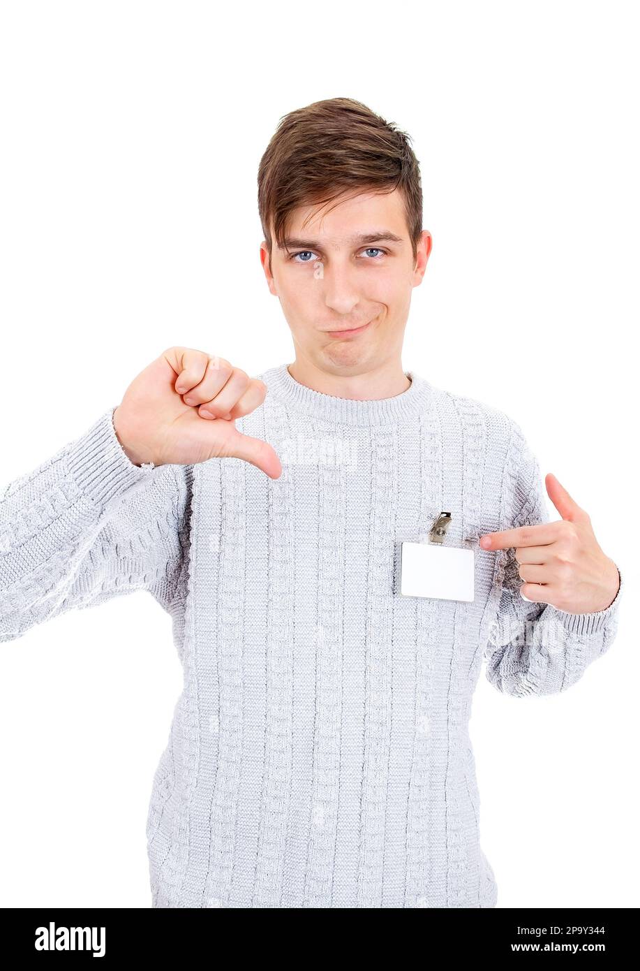 Displeased Young Man with the Empty Badge show Thumb Down Gesture on the White Background Stock Photo
