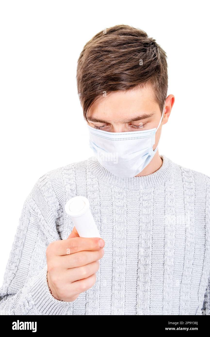 Young Man in the Flu Mask with a Pills Isolated on the White Background Stock Photo