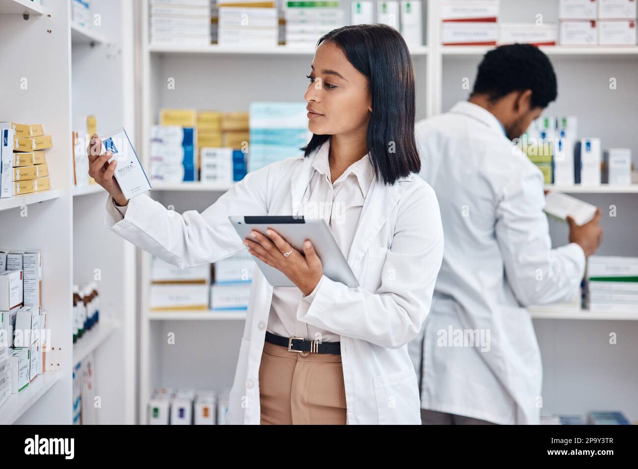 Pharmacy stock tablet, Indian pharmacist and nurse checklist of medicine and pills. Woman