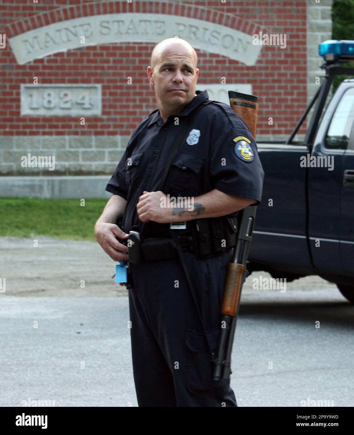 Corrections officer Randy Whitman stands guard at the entrance of the Maine  State Prison in Warren, Maine, on Monday, June 30, 2008. Prison officials  report that two people have been taken hostage, image size:1130x1390