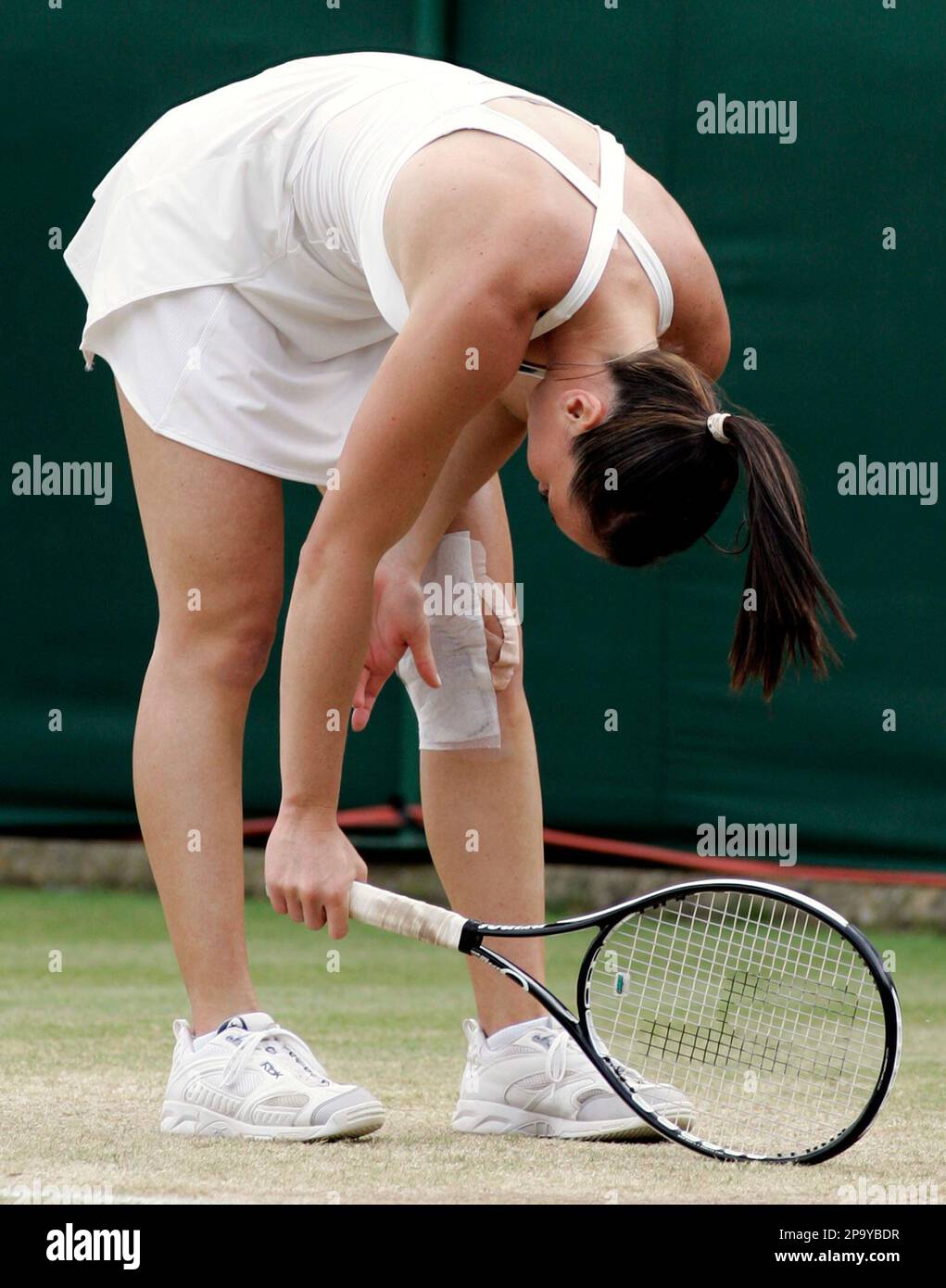 Serbia's Jelena Jankovich reacts during her fourth round match against Thailand's Tamarine Tanasugarn at Wimbledon, Monday, June 30, 2008. (AP Photo/Sang Tan) Stock Photo