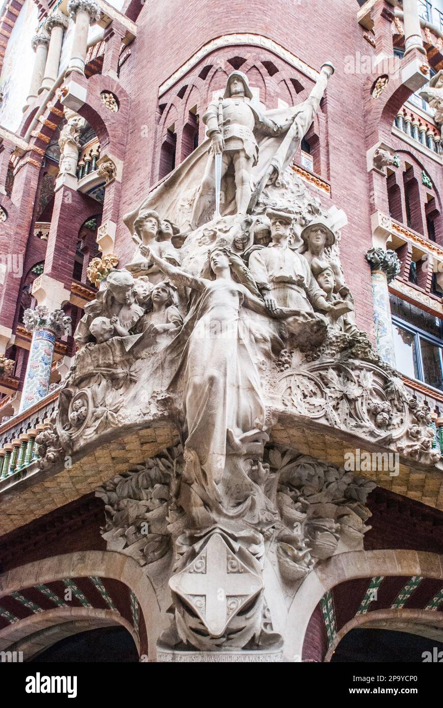 Miguel Blay created a group of sculptures titled “La canción popular catalana” (The Catalan Folk Song) for the facade of the building. Stock Photo