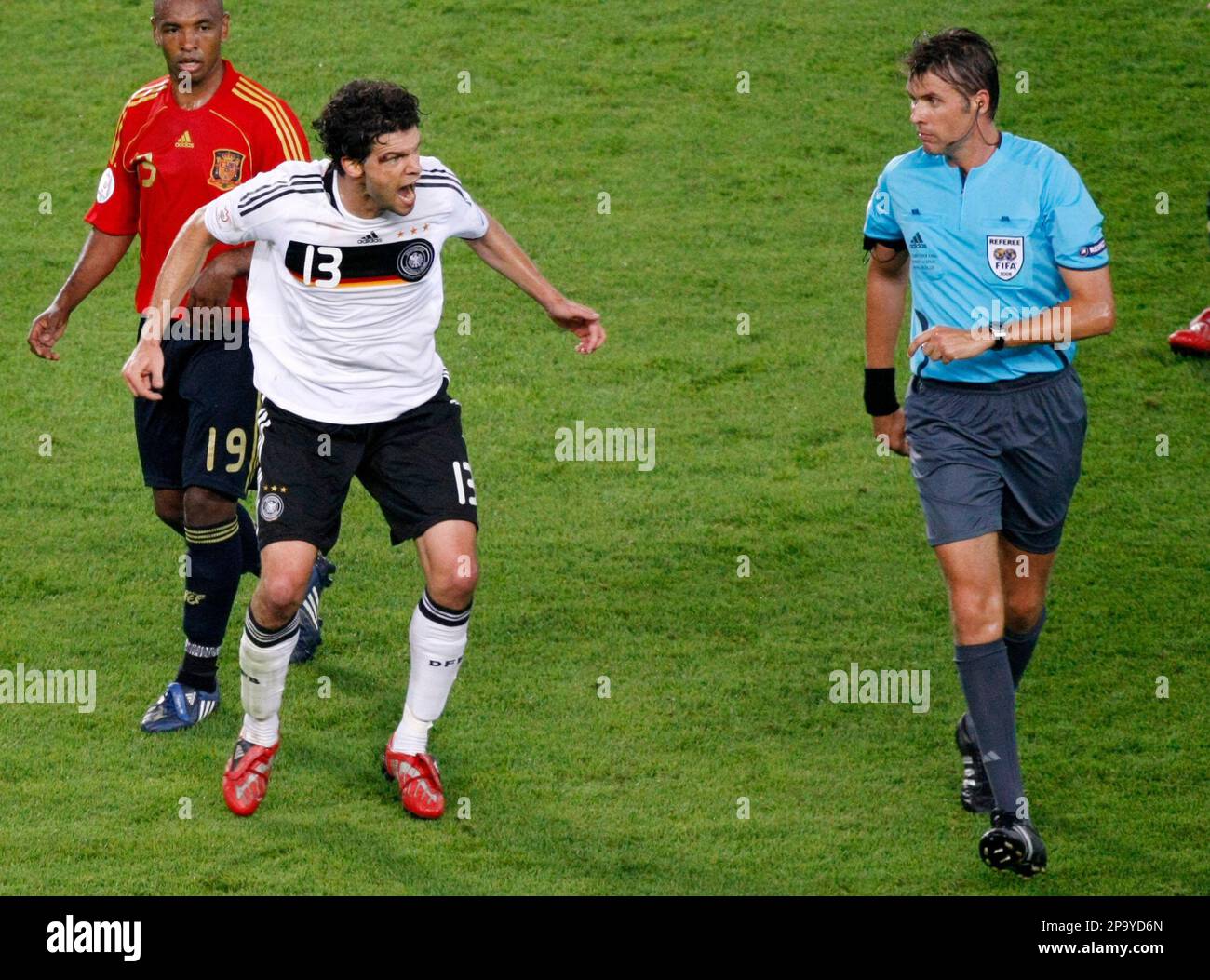 Germany s Michael Ballack second left reacts beside Spain s