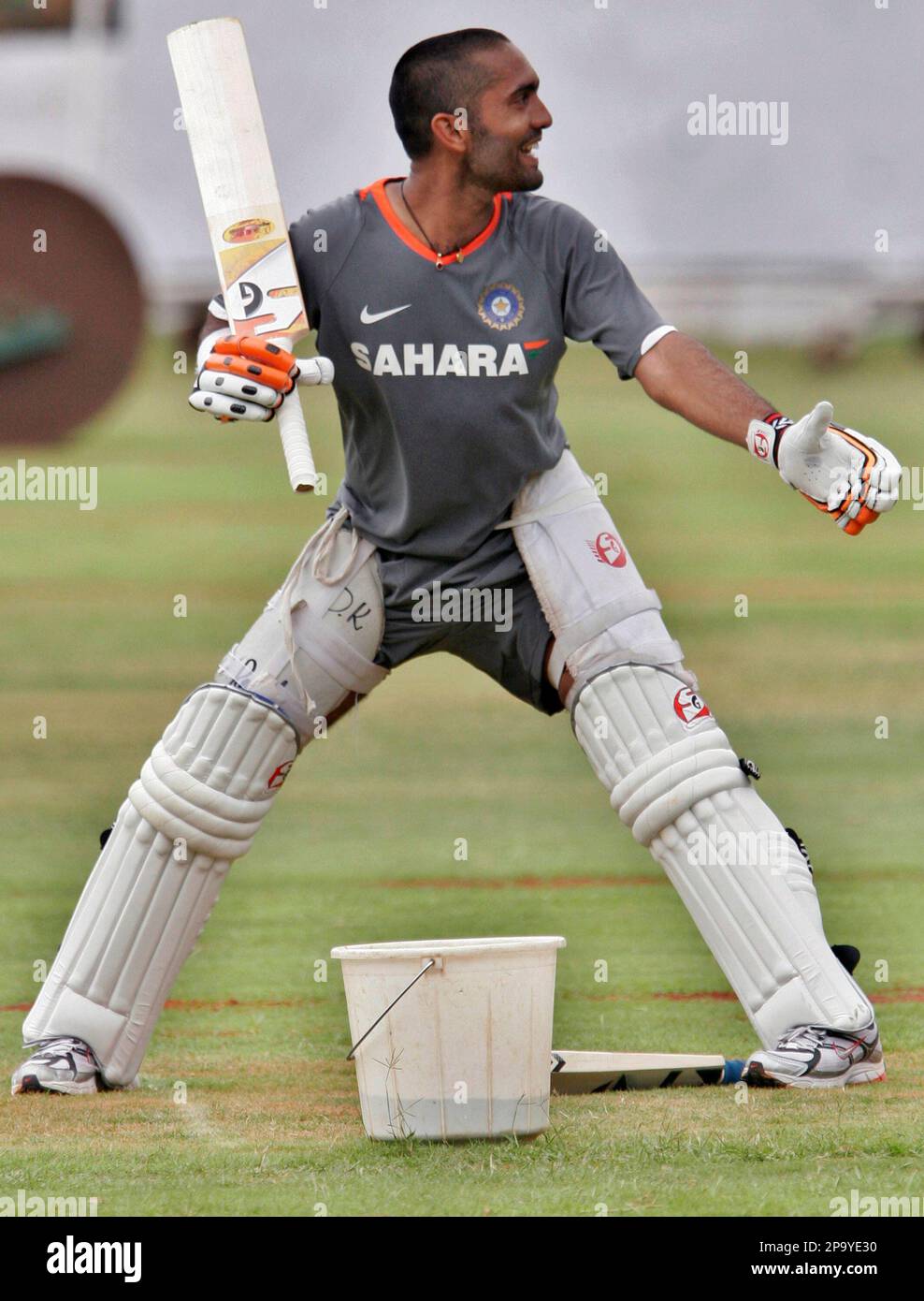 Wasim Rahi India's Dinesh Karthik gestures to his teammate Wasim Jaffer, unseen ...