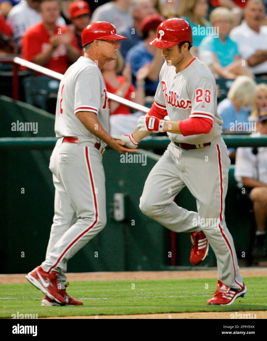 Philadelphia Phillies Chase Utley, center, is congratulated by