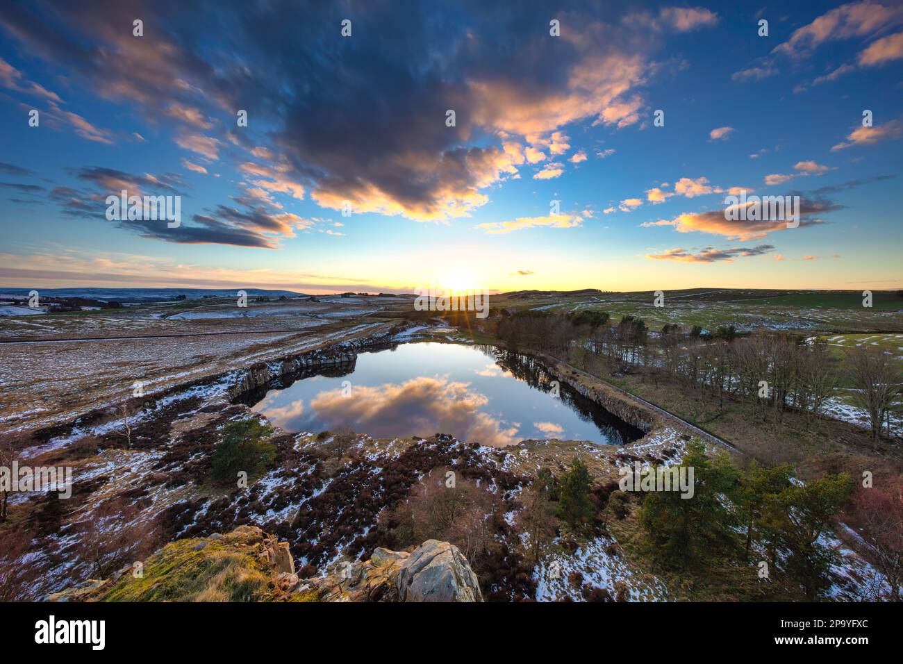 Sunset at Cawfields on Hadrian's Wall in winter looking west ...