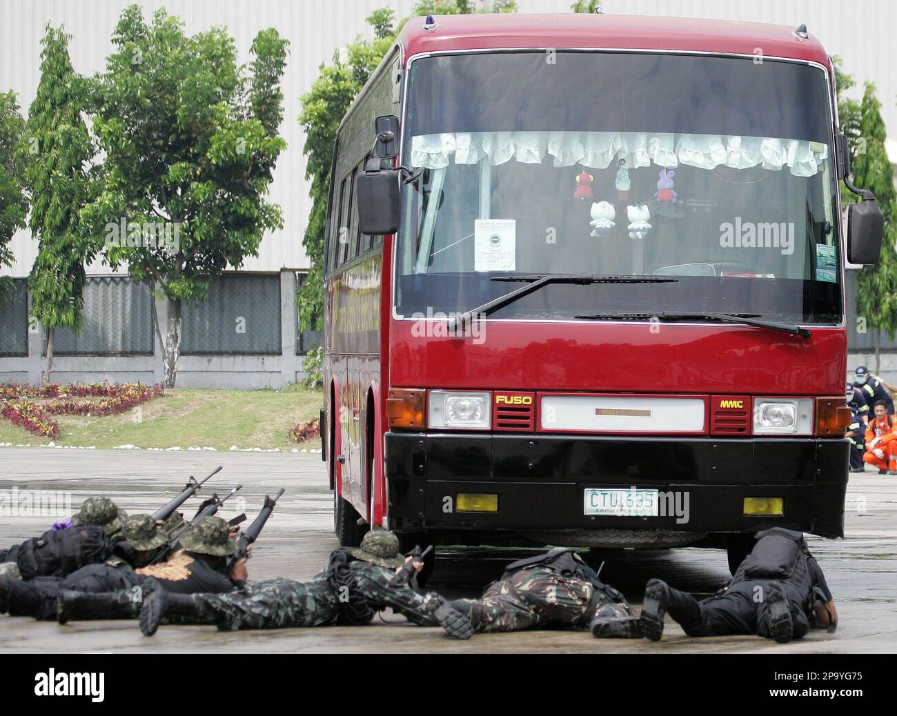 Philippine Air Force Reserve Command aim their guns on a bus during a
