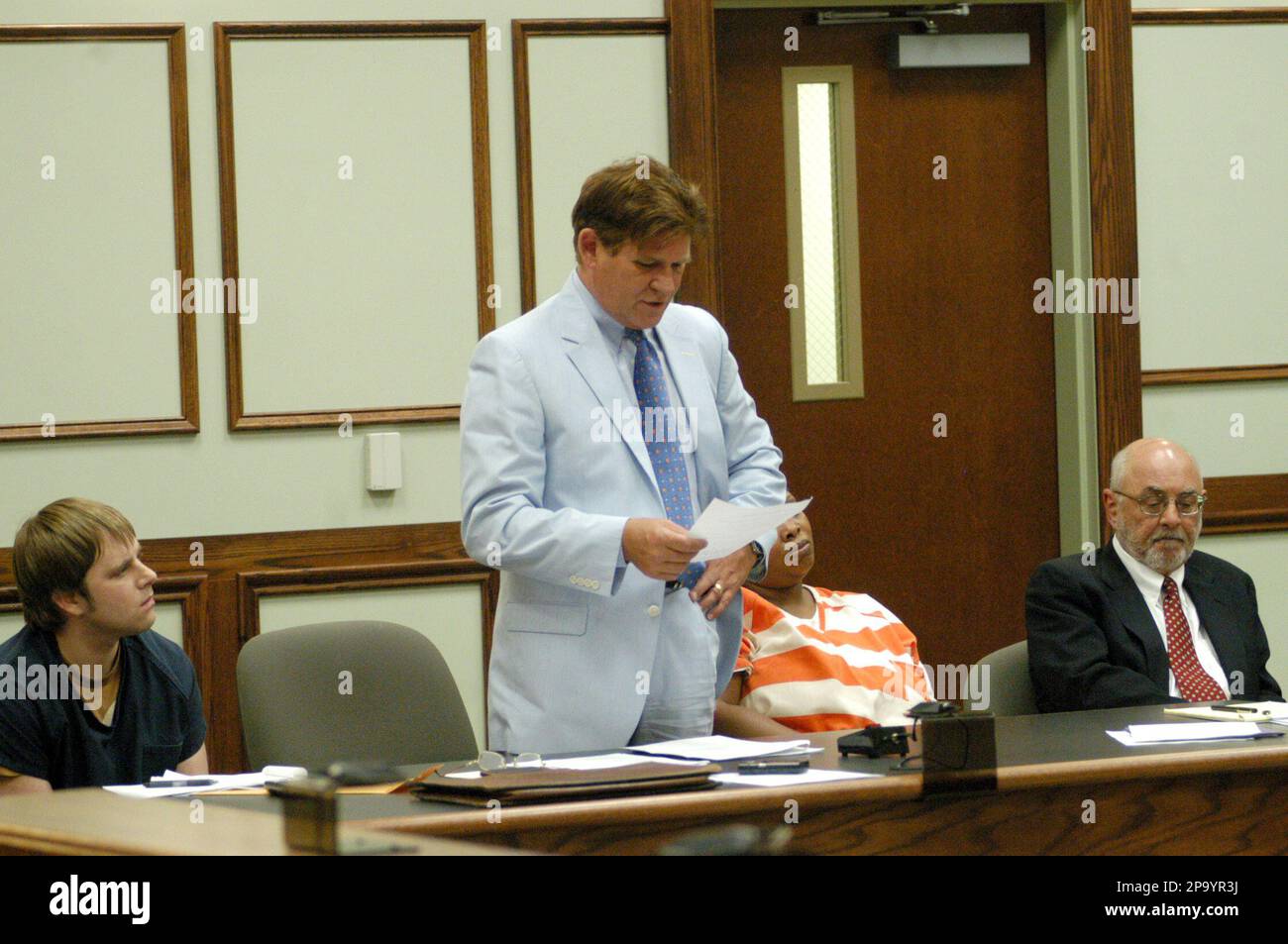 Jeff Burton looks at his attorney, Mark Bryant, as Tamara Caldwell and
