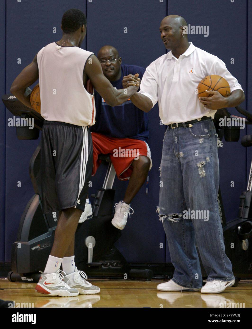 Charlotte Bobcats part owner and managing member of basketball operations Michael  Jordan, left, talks with guard Raymond Felton as the Bobcats defeat the  Boston Celtics 114-106 in overtime in Charlotte, North Carolina
