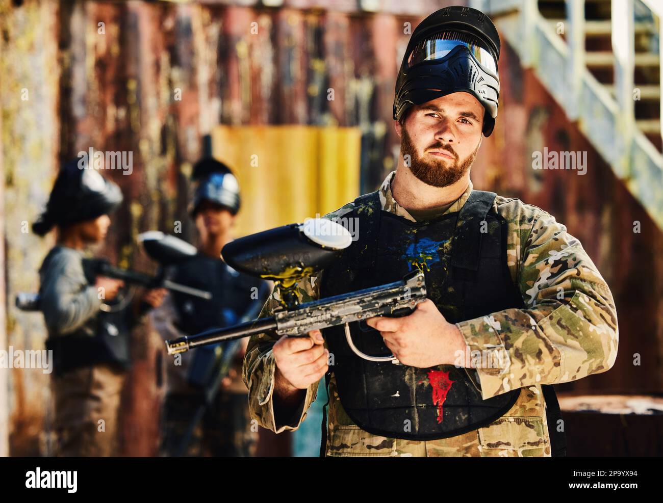 Paintball, serious or portrait of man with gun in shooting game playing in action battlefield mission
