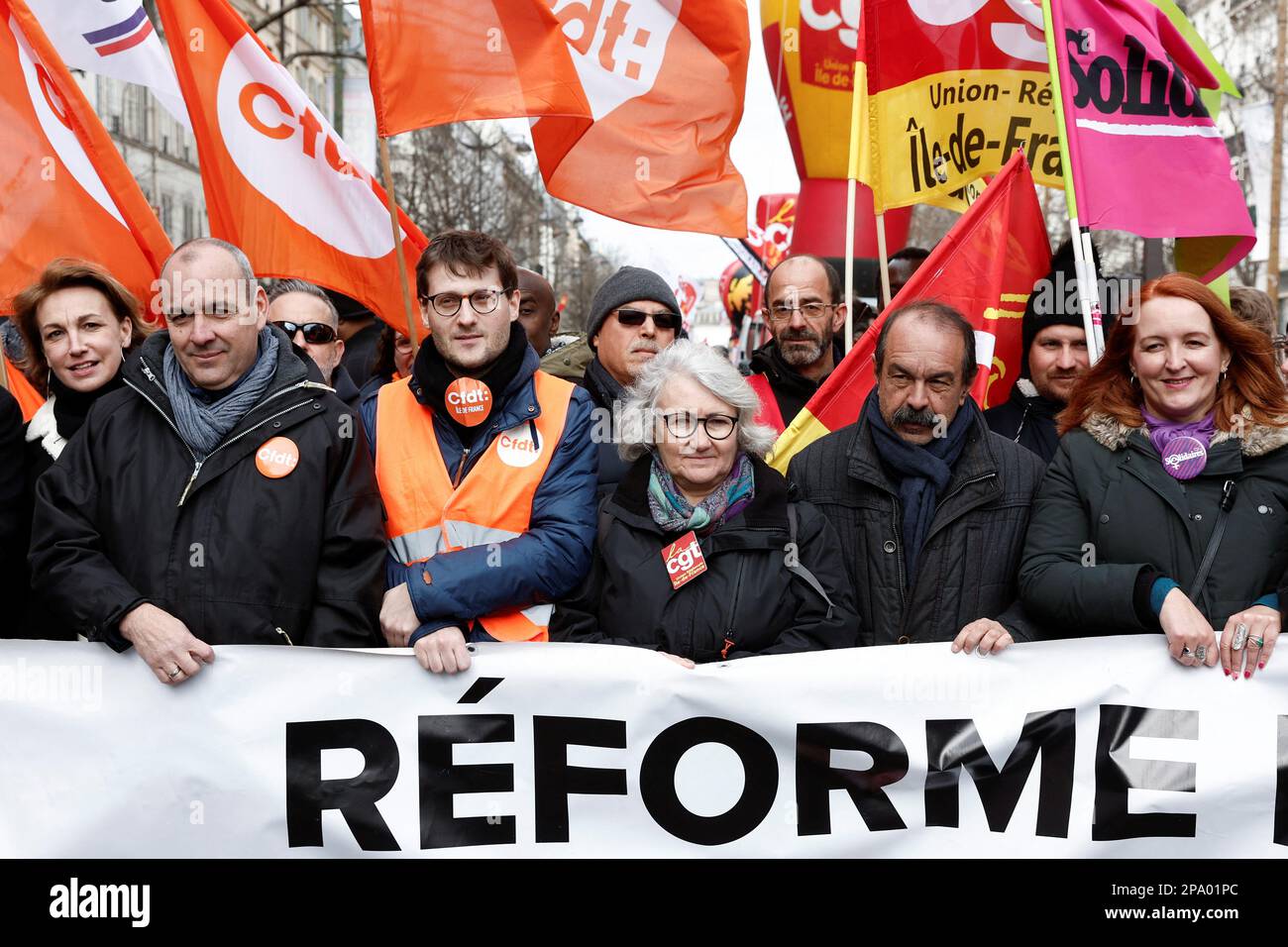 CGT union leader Philippe Martinez and Laurent Berger, secretary general of French Democratic Confederation of Labour (CFDT) hold a banner with others at a demonstration against the government's pension reform plan in Paris, France, March 11, 2023. REUTERS/Benoit Tessier Stock Photo
