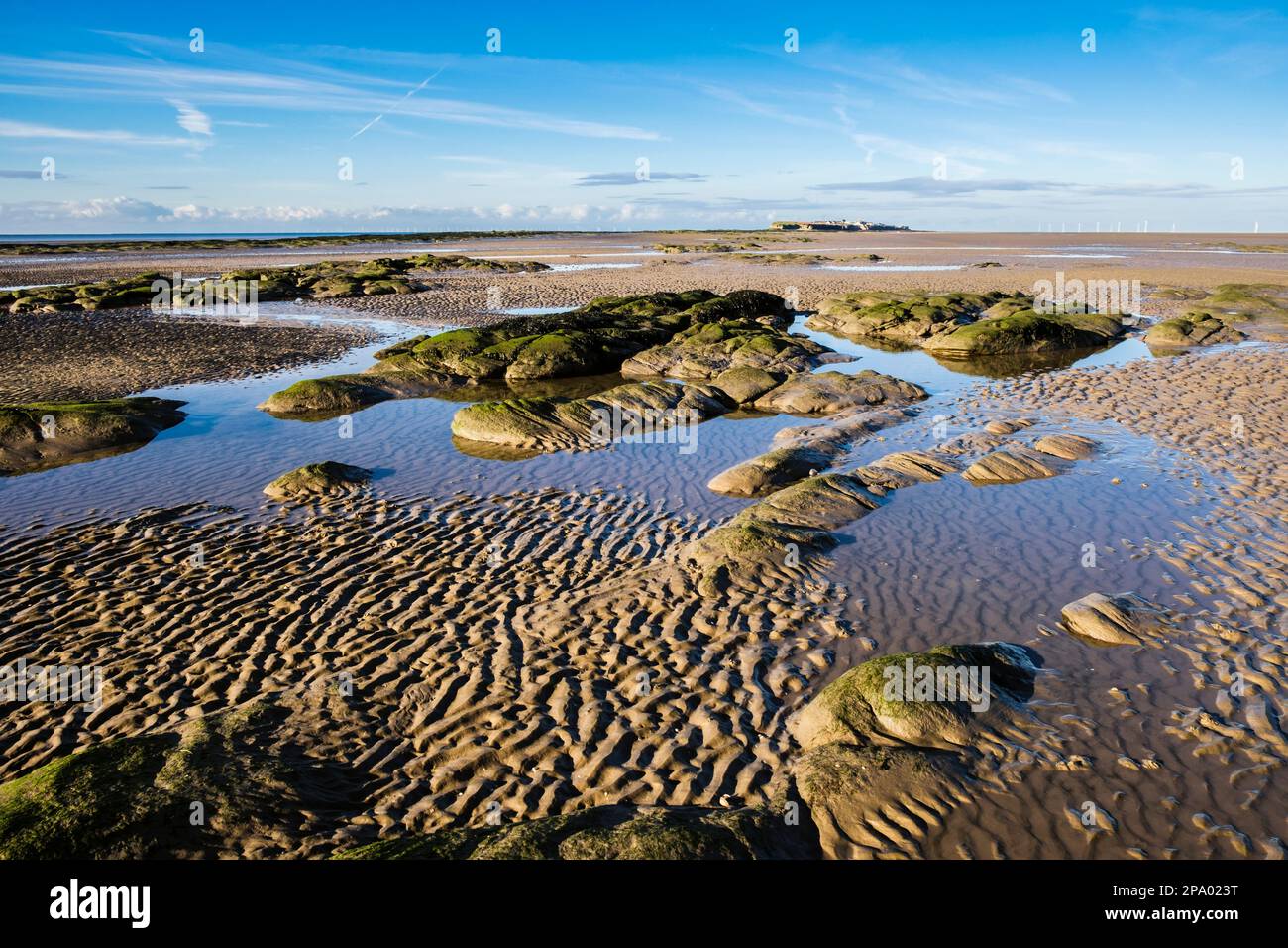 Tidal pools in sand between Little Eve island and Little Hilbre Island