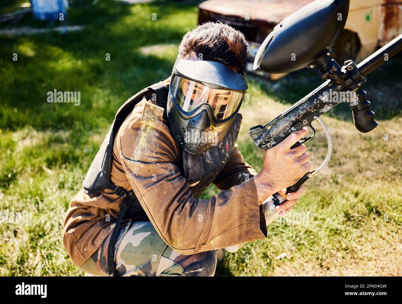 Paintball, target practice or male with gun in shooting game playing