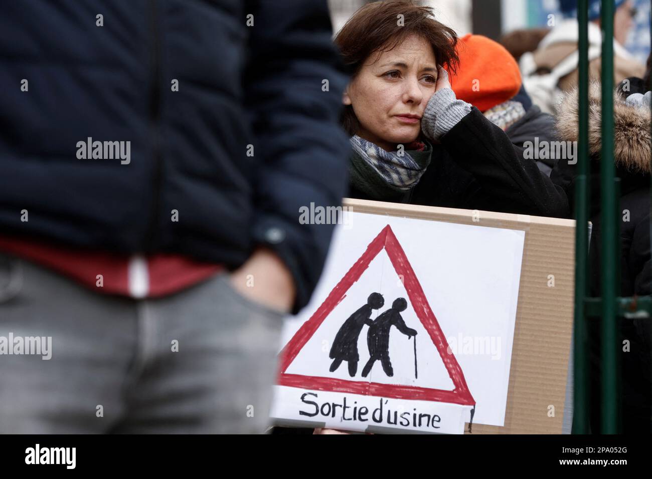 A woman holds a placard at a demonstration against the government's pension reform plan in Paris, France, March 11, 2023. REUTERS/Benoit Tessier Stock Photo