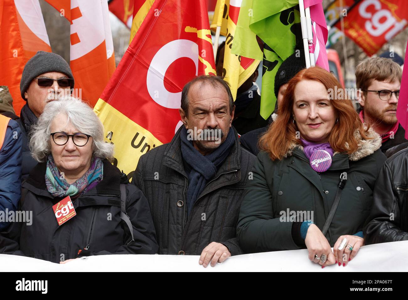 CGT union leader Philippe Martinez holds a banner with others at a demonstration against the government's pension reform plan in Paris, France, March 11, 2023. REUTERS/Benoit Tessier Stock Photo