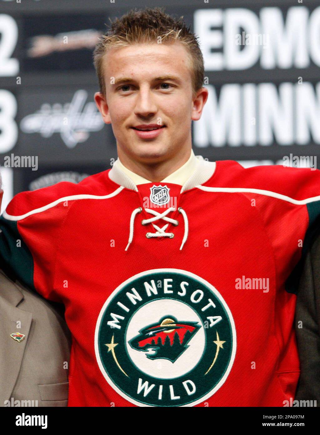 Tyler Cuma puts on a Minnesota Wild jersey after being chosen as the team's first-round pick at the NHL hockey draft in Ottawa on Friday, June 20, 2008. (AP Photo/The Canadian Press, Fred Chartrand) Stock Photo