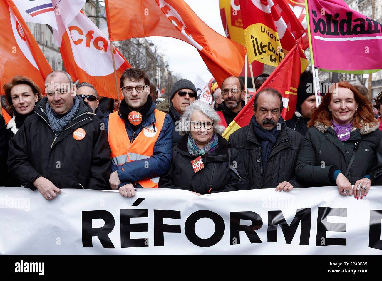 Laurent Berger, secretary general of French Democratic Confederation of Labour (CFDT) and CGT union leader Philippe Martinez hold a banner with others at a demonstration against the government's pension reform plan in Paris, France, March 11, 2023. REUTERS/Benoit Tessier Stock Photo