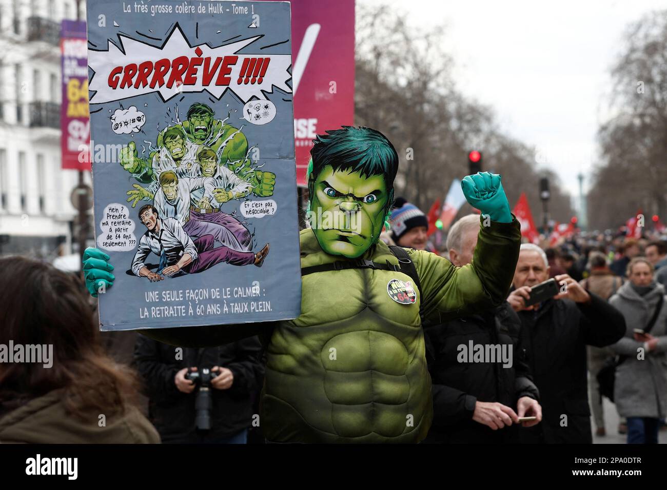A demonstrator dressed as The Hulk comic book character holds a sign at a protest against the government's pension reform plan in Paris, France, March 11, 2023. REUTERS/Benoit Tessier Stock Photo