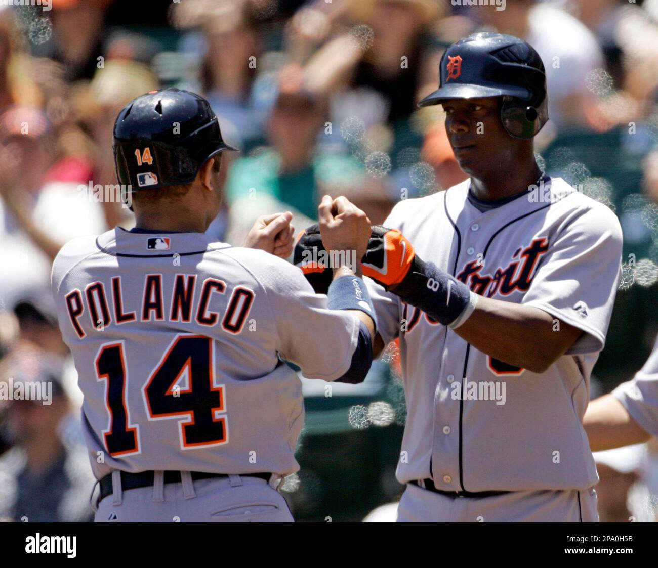 Detroit Tigers' Placido Polanco, right, is congratulated by Miguel Cabrera  after scoring in the third inning of a baseball game against the Kansas  City Royals, Saturday, Aug. 30, 2008, in Detroit. (AP