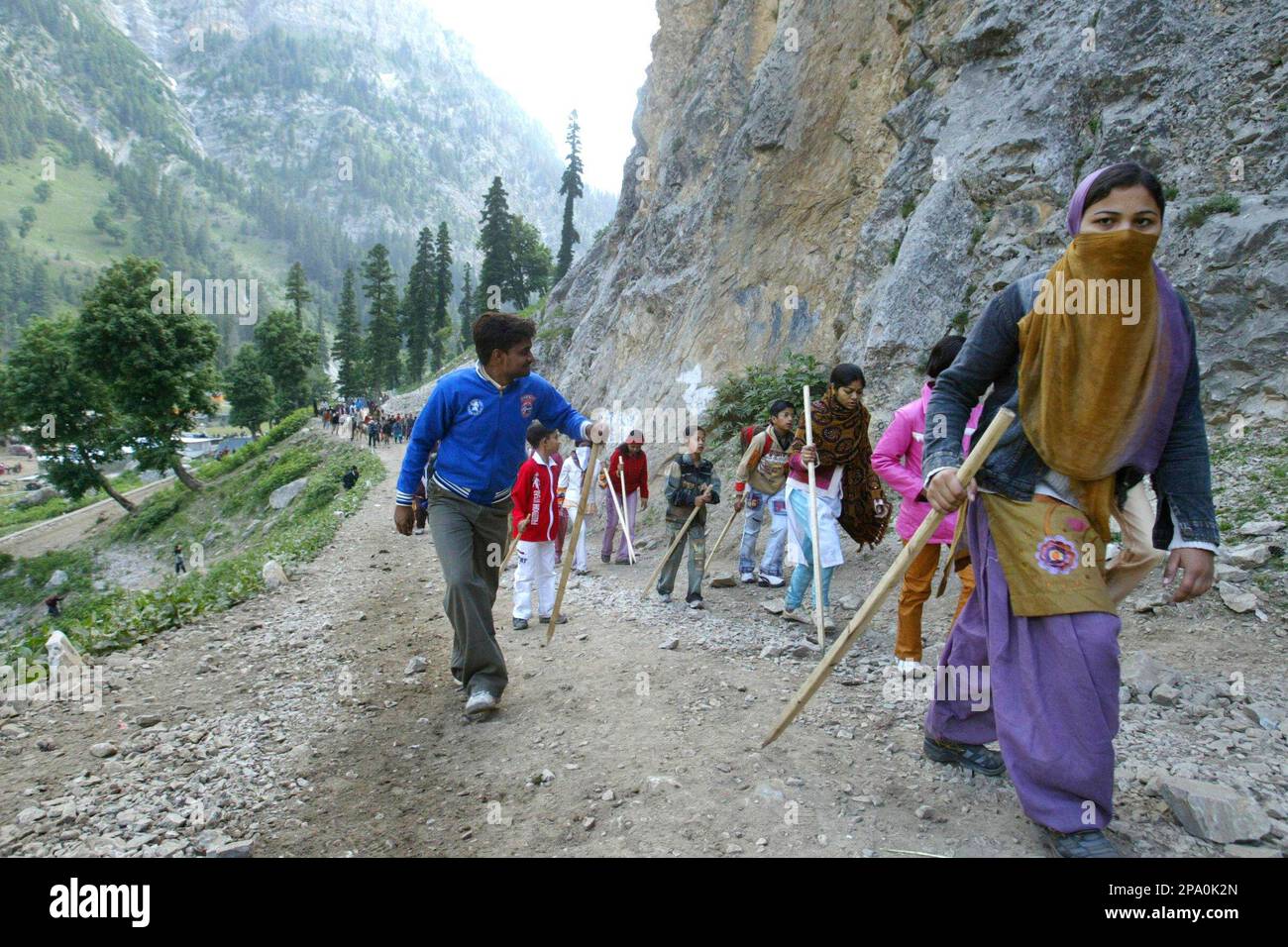 Hindu pilgrims trek to the Amarnath shrine near near Dumail, 135 kilometers  (85 miles) northeast of Srinagar, India, Wednesday, June 18, 2008. Hundreds  of pilgrims annually go to the remote Himalayan shrine