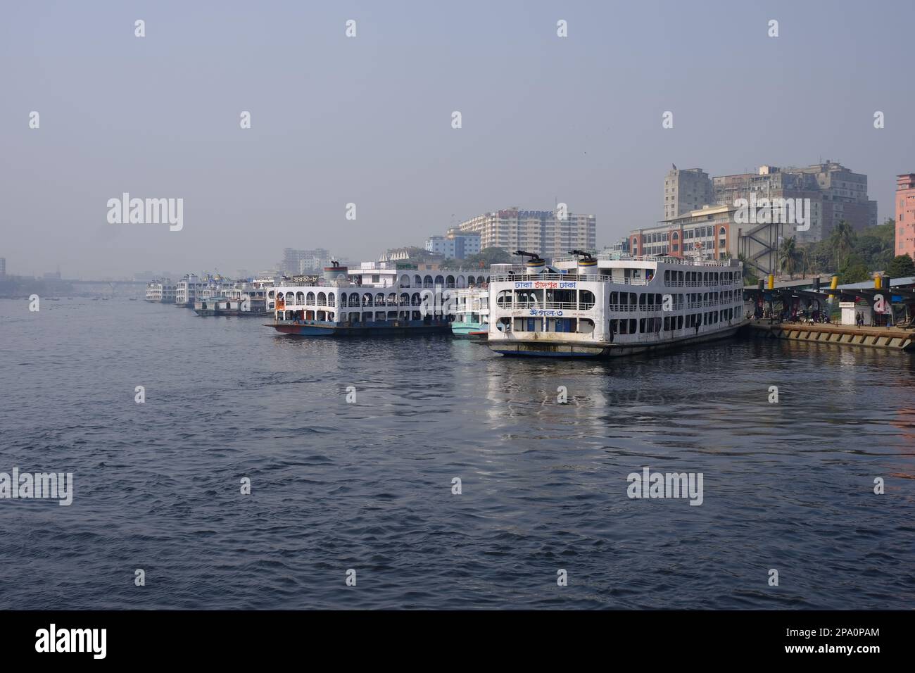 Sadarghat, the main river port of Bangladesh. From here the launches go to various destinations in Southern districts. Some launches are seen anchored Stock Photo