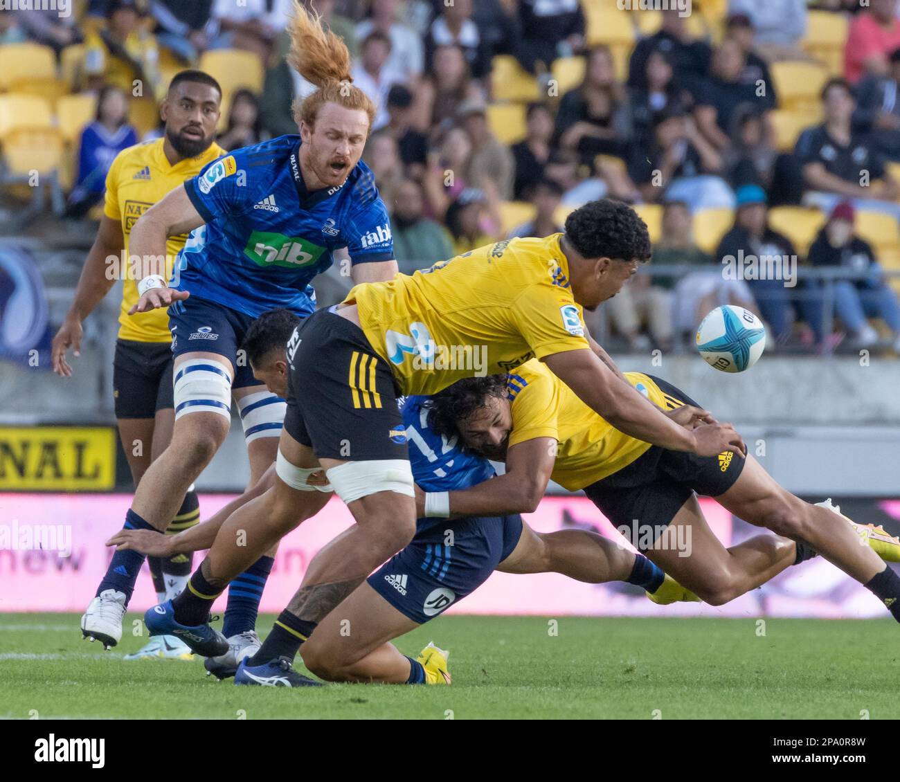 March 11, 2023, Wellington, Te Whanganui-a-Tara, New Zealand Wellington, New Zealand, 11 March 2023 Roger Tuivasa-Sheck (12 Auckland Blues) gets hit hard by two defenders