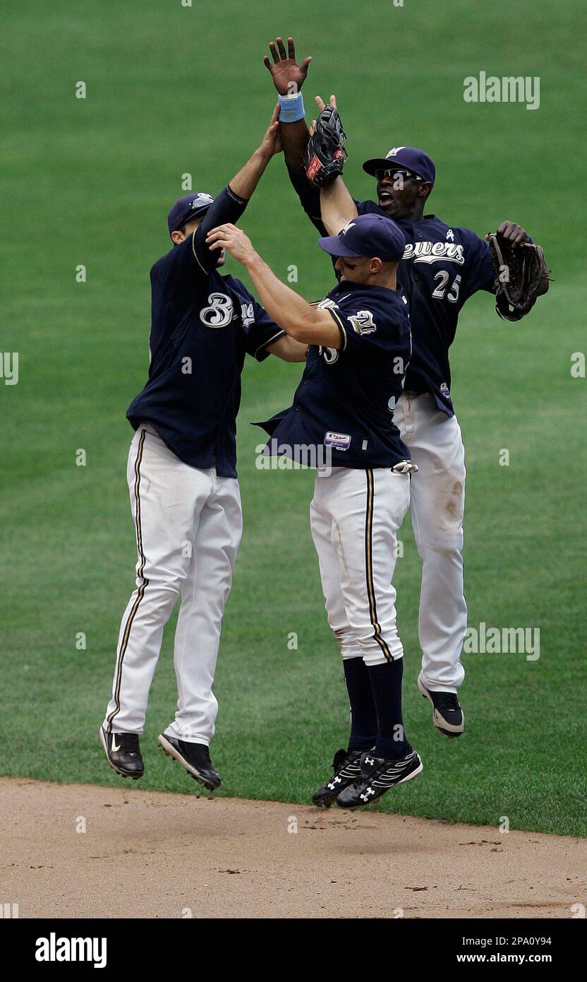 Milwaukee Brewers' Mike Cameron (25), Gabe Kapler, center, and Ryan Braun  celebrate after the ninth inning of a baseball game against the Minnesota  Twins Sunday, June 15, 2008, in Milwaukee. The Brewers